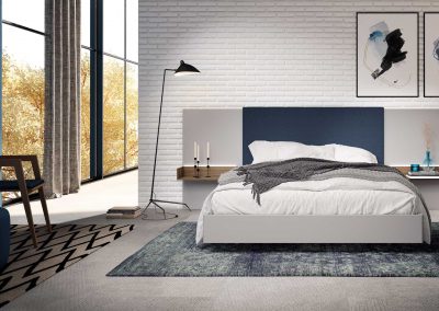dormitorio con cabezal tapizado